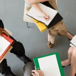 Business people sitting in chairs